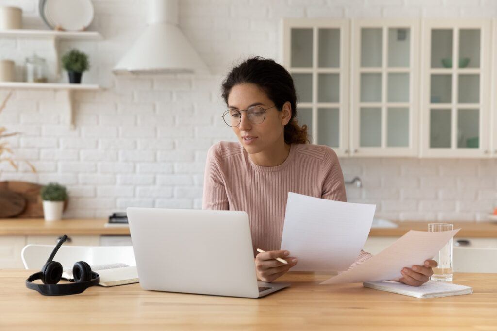 Woman putting together documents to request a restraining order