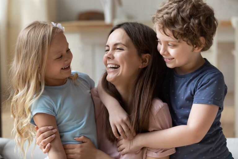 Happy mom having fun with her children after modifying a custody ruling