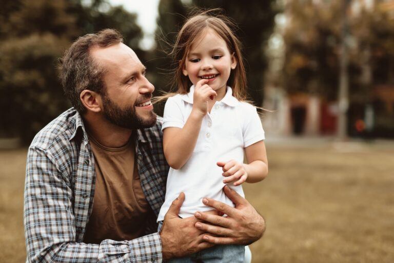 Father having fun playing with his daughter