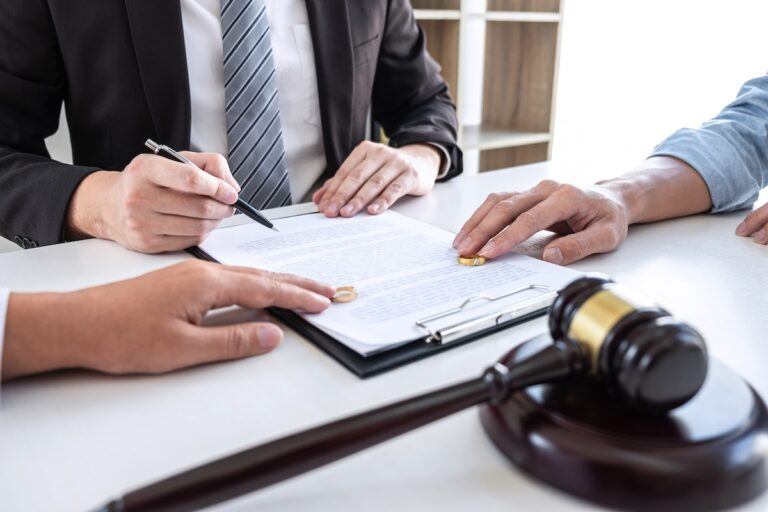 Parties reviewing divorce orders with an attorney