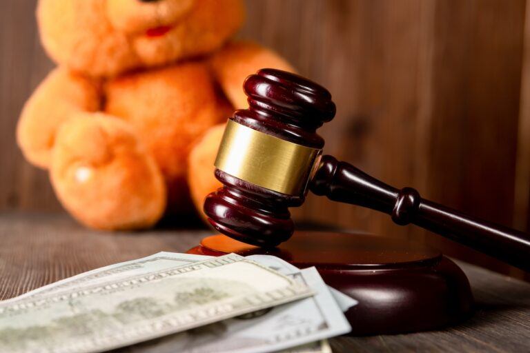 Gavel and money indicating a legal ruling on child support