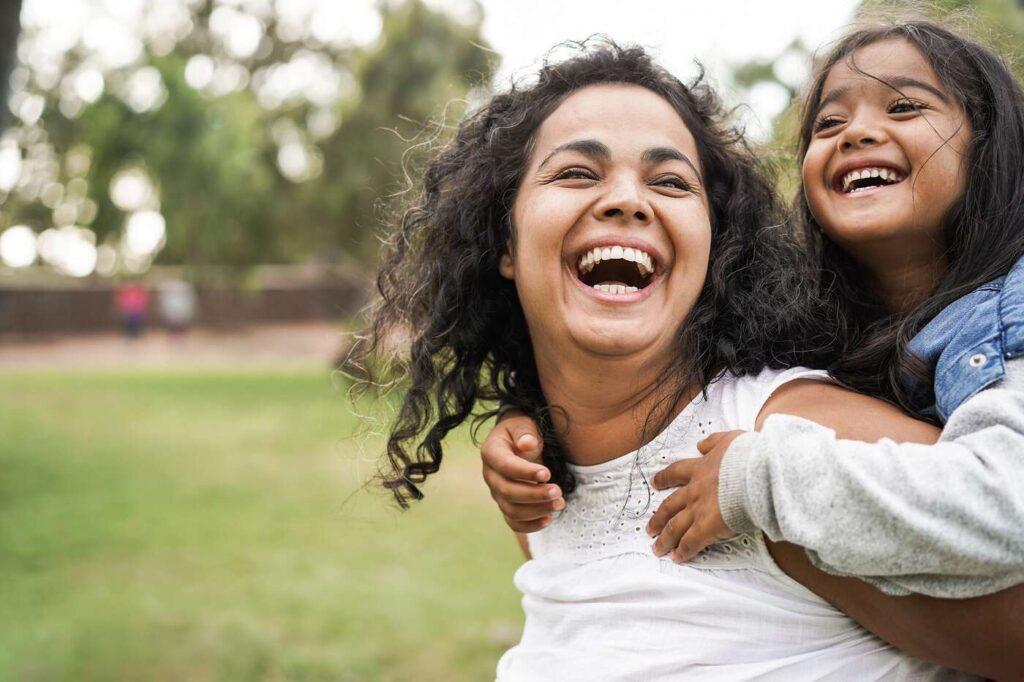 Adult and child laughing